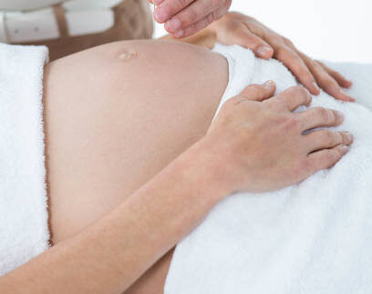 Pregnant woman in an acupuncture therapy